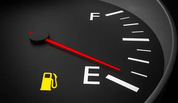 Car fuel gauge showing low efficiency
